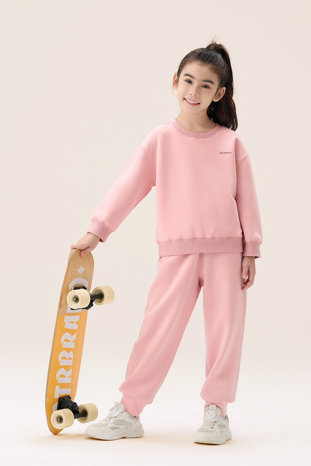 Girls pink sweatshirt jogger set with sneakers
