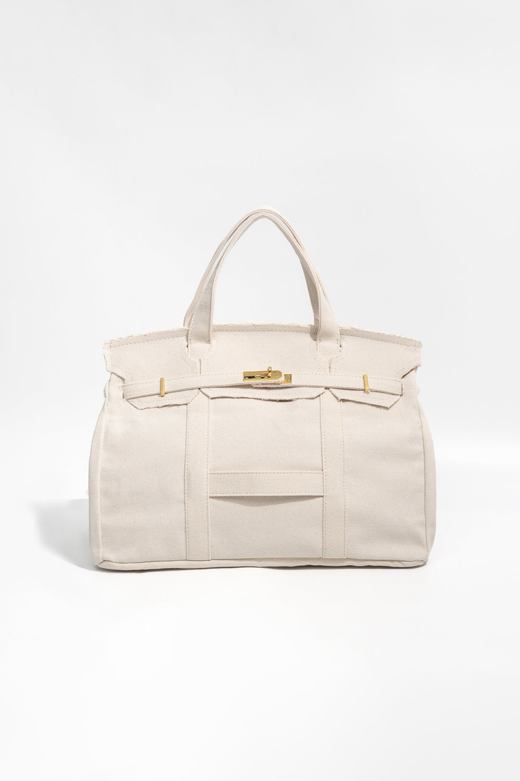 Beige handbag with navy accents on a white background