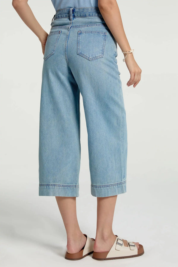 Back view of light blue cropped wide-leg jeans with a clean, modern fit