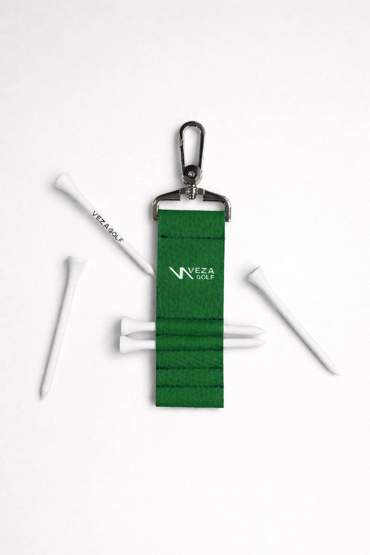 Green Tee Holder with metal clip and white sticks on a white background