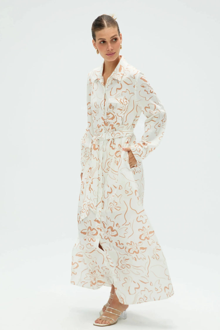 Side view of women’s sand bloom belted shirt dress with flowing silhouette