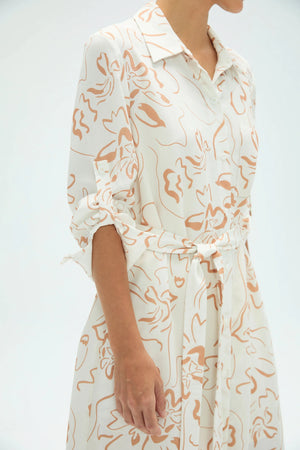 Close-up of sand bloom shirt dress highlighting sleeve detail and soft floral print
