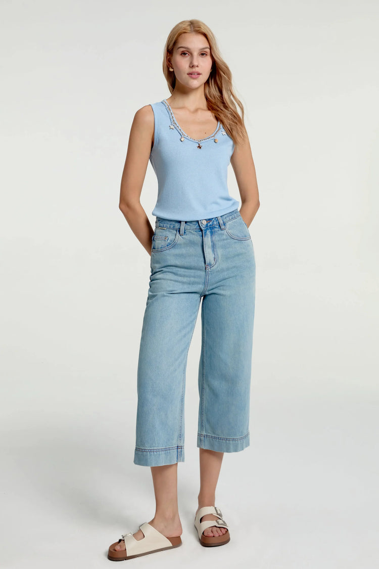 Women’s coastal blue charm knit tank styled with navy jeans for a clean full-body look