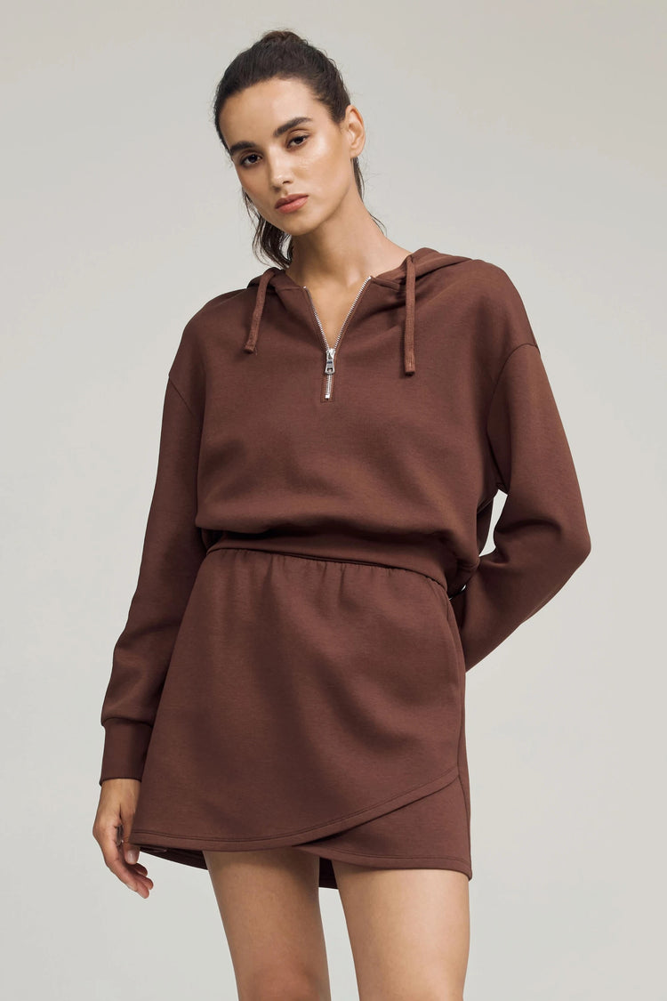 Emara chestnut brown fleece skirt styled with a matching hoodie for a coordinated, effortless everyday look.