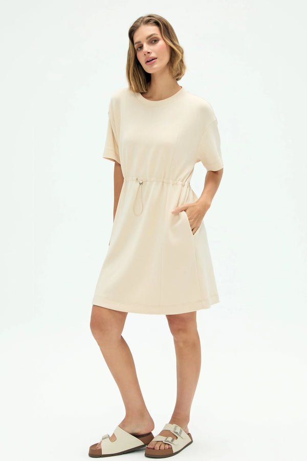Women’s soft oatmilk cinched T-shirt dress in oatmilk beige with drawstring waist and pockets, full-body front view