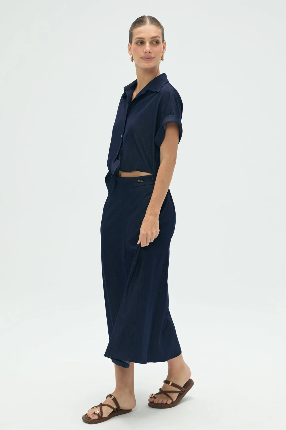Women’s deep navy coastal set with relaxed button-up shirt and flowy midi skirt, full-body front view
