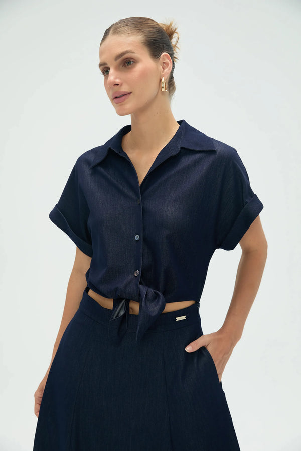 Upper-body view of women’s deep navy coastal set highlighting relaxed button-up shirt