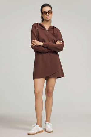 Cropped half-zip hoodie designed for effortless everyday wear, styled with a matching skirt