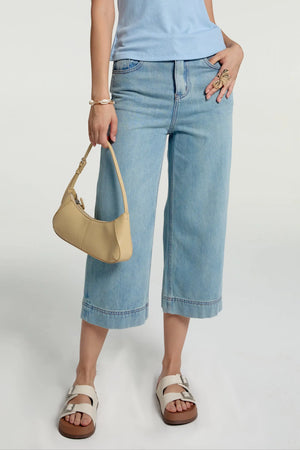 Front view of light blue cropped wide-leg jeans with a high-rise fit