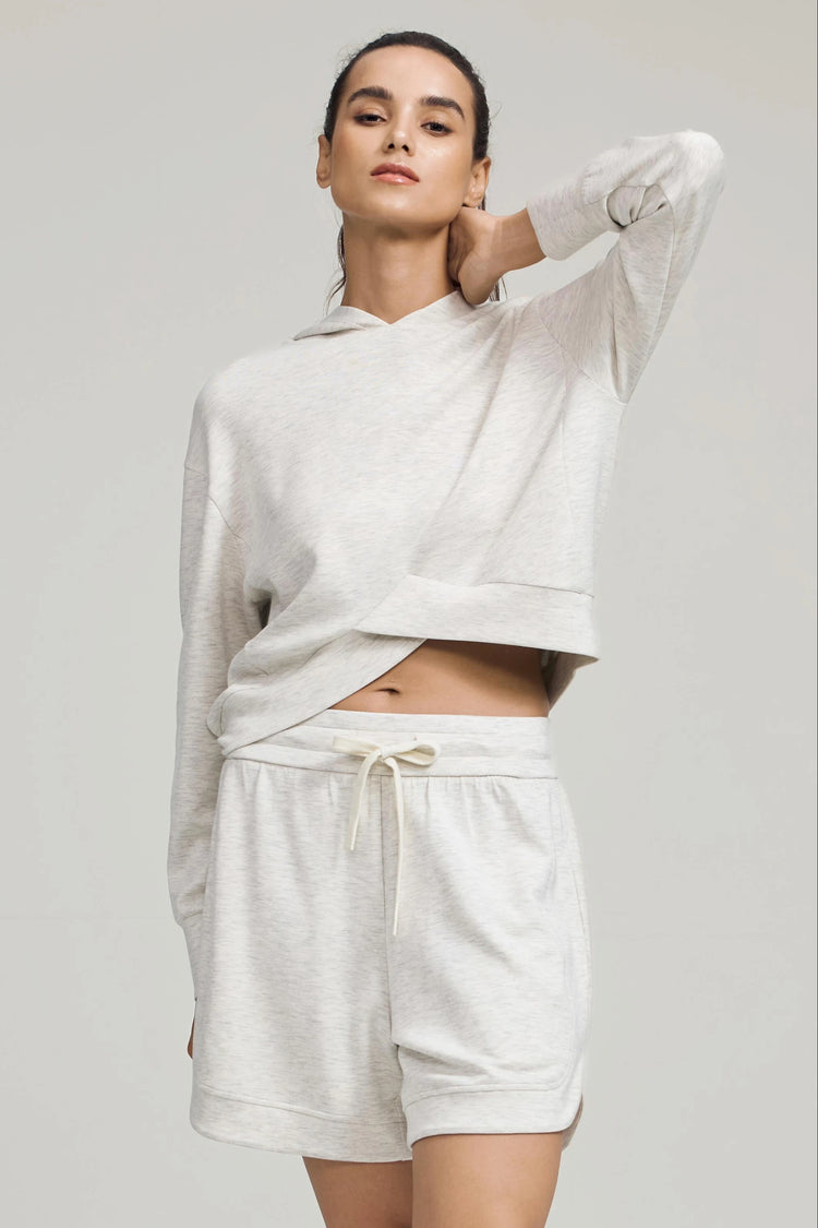 Light grey lounge shorts styled with a matching pullover for a coordinated look
