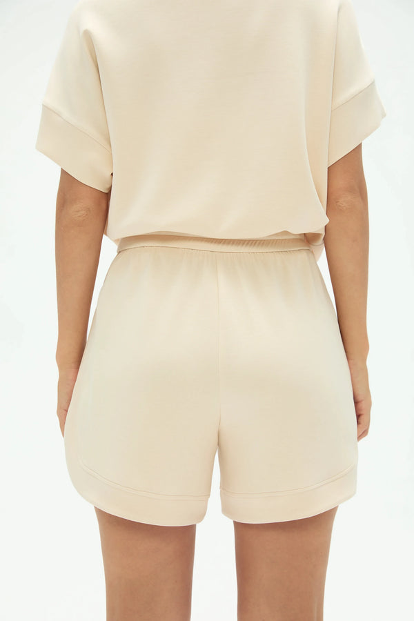 Back view of soft oatmilk lounge shorts featuring a clean, comfortable silhouette