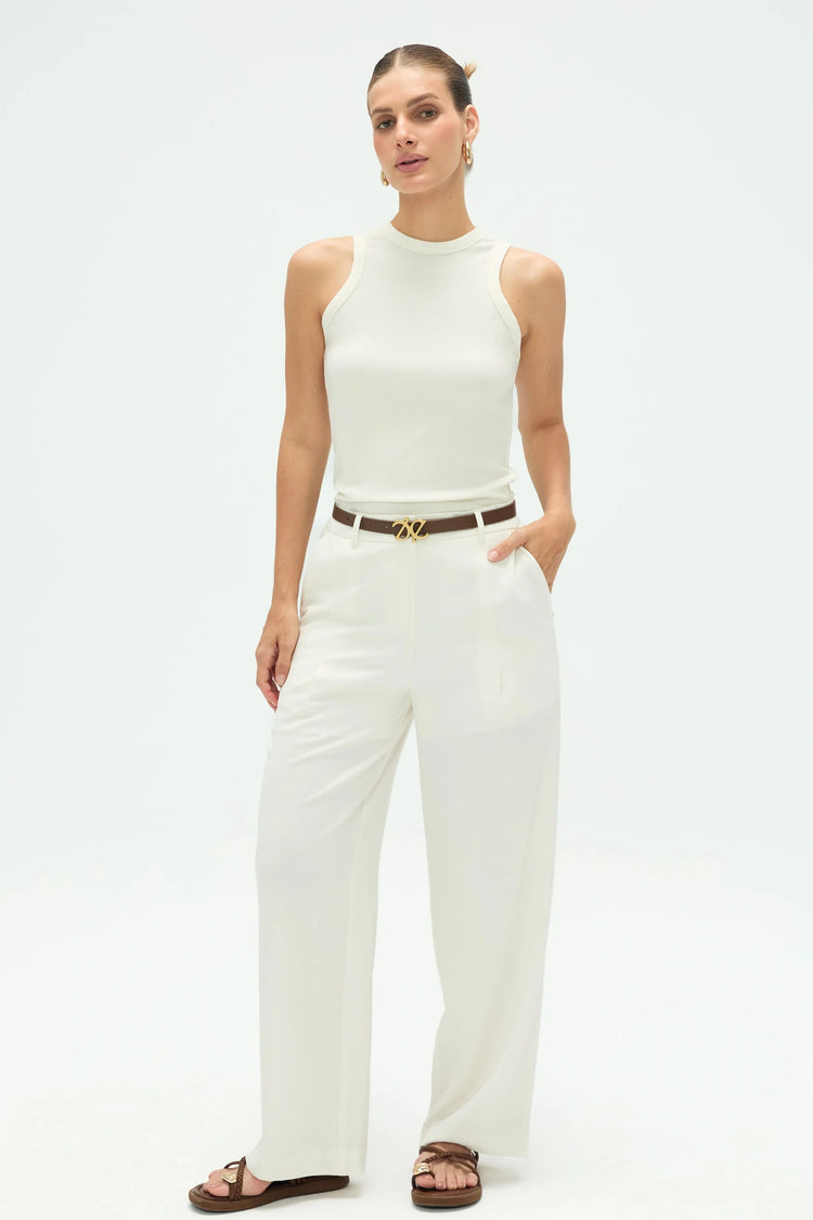 High-rise flow tailored trousers paired with a beige tank for effortless sophistication