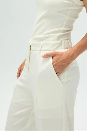 Detail view of the tailored pocket construction on lightweight crepe trousers