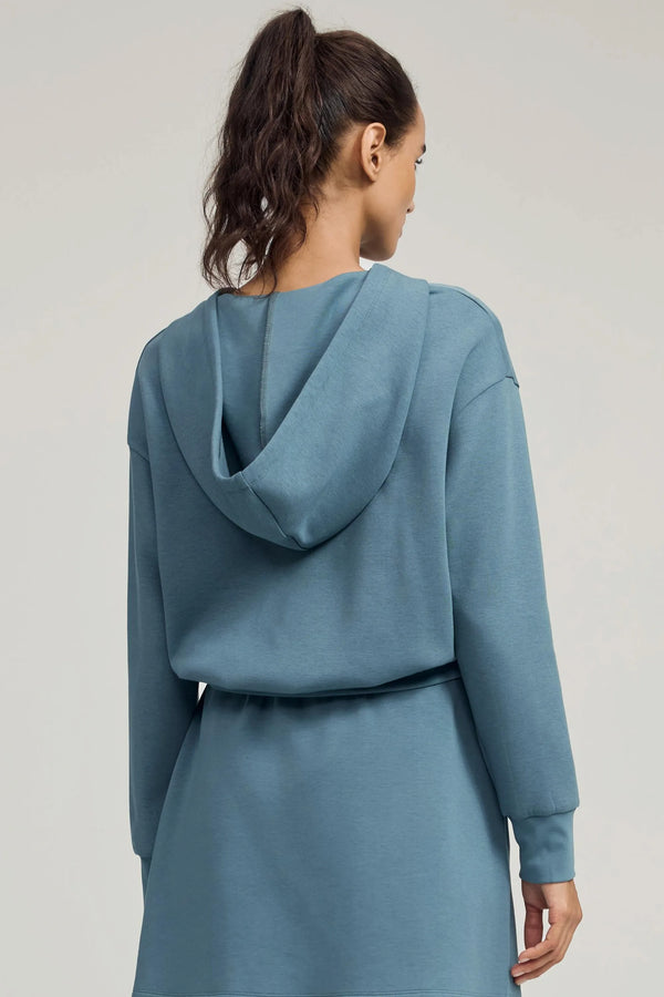 Back view of women’s slate blue cropped half-zip hoodie with clean silhouette