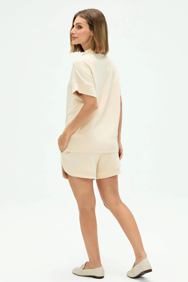 Back view of a short-sleeve Tencel™ lounge polo with a clean, relaxed silhouette