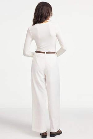 Back view of women’s long-sleeve ivory bodysuit with clean, seamless silhouette