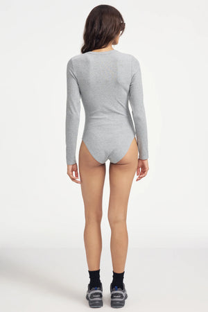 Back view of women’s light grey Henley bodysuit with clean, seamless silhouette