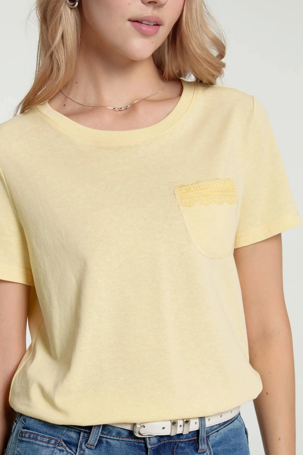 Women’s sunbeam yellow lace-trim pocket tee styled with blue jeans, upper-body front view