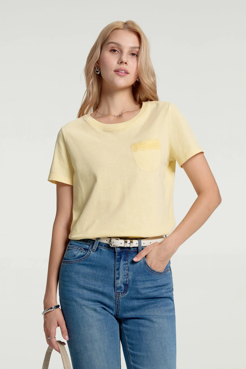 Women’s sunbeam yellow lace-trim pocket tee styled with blue jeans, upper-body front view