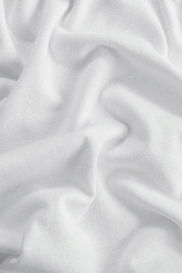 Close-up of cloud white linen Supima cotton tee fabric showing smooth texture and subtle structure