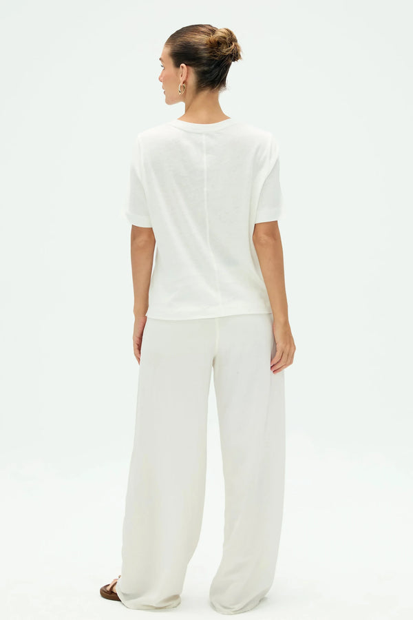 Back view of women’s cloud white linen Supima cotton tee with clean, minimal lines