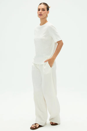 Side view of women’s cloud white linen Supima cotton tee showing smooth drape and relaxed silhouette