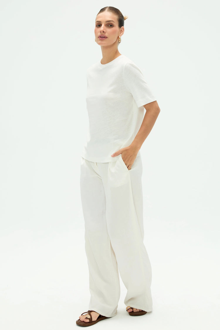 Side view of women’s cloud white linen Supima cotton tee showing smooth drape and relaxed silhouette
