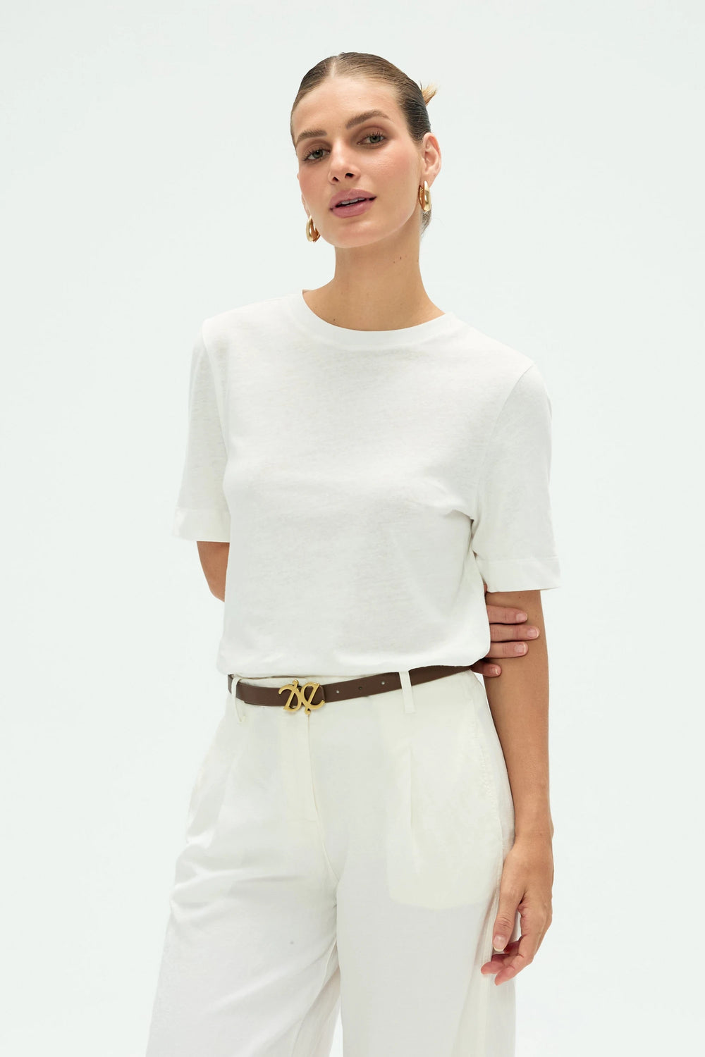 Women’s cloud white linen Supima cotton crewneck tee styled with white pants, upper-body front view