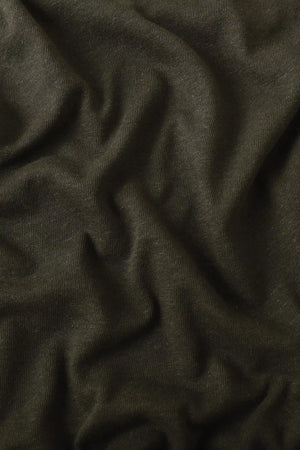 Close-up of espresso linen Supima cotton tee fabric showing smooth texture and subtle structure