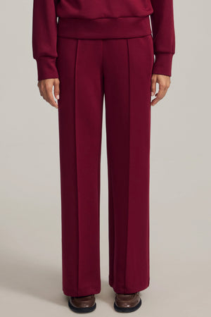 Front view of Burgundy Wine high-rise flare pants with a clean, elegant silhouette