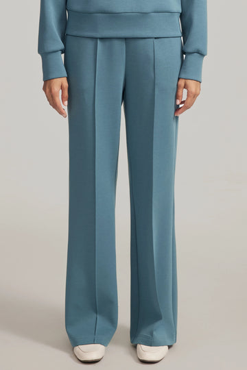 Front view of luxe flare pants in Slate Blue featuring a high-rise, wide-leg silhouette