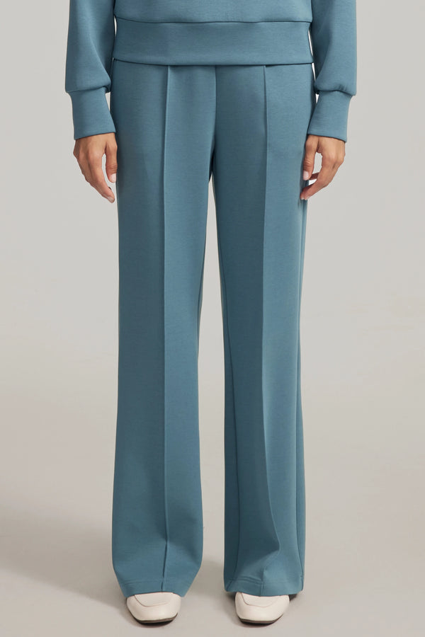 Front view of luxe flare pants in Slate Blue featuring a high-rise, wide-leg silhouette