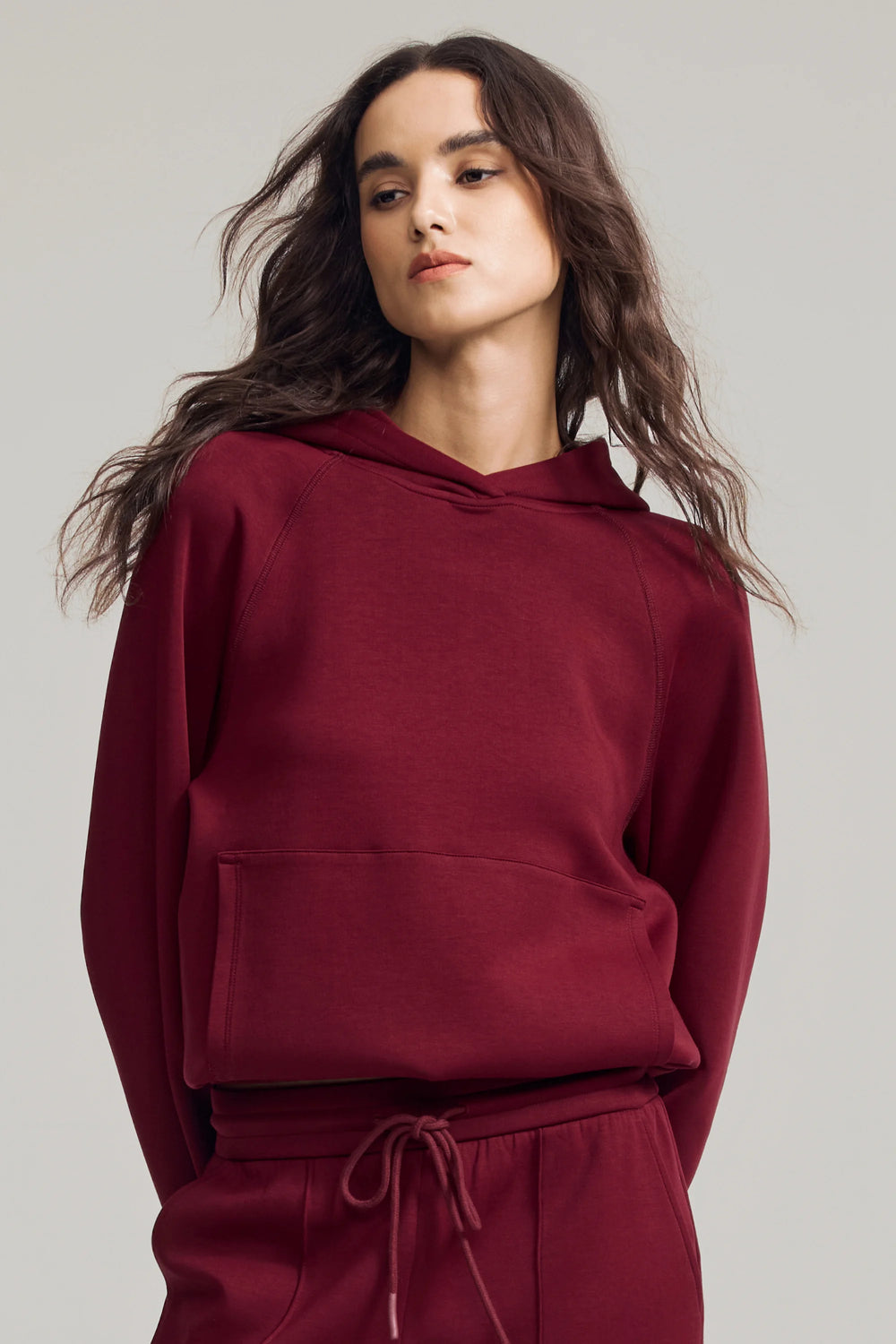 Women’s burgundy wine fleece hoodie with relaxed fit and clean neckline