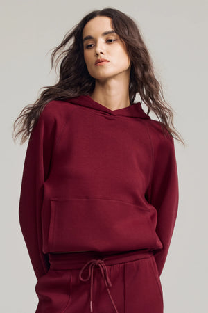 Women’s burgundy wine fleece hoodie with relaxed fit and clean neckline