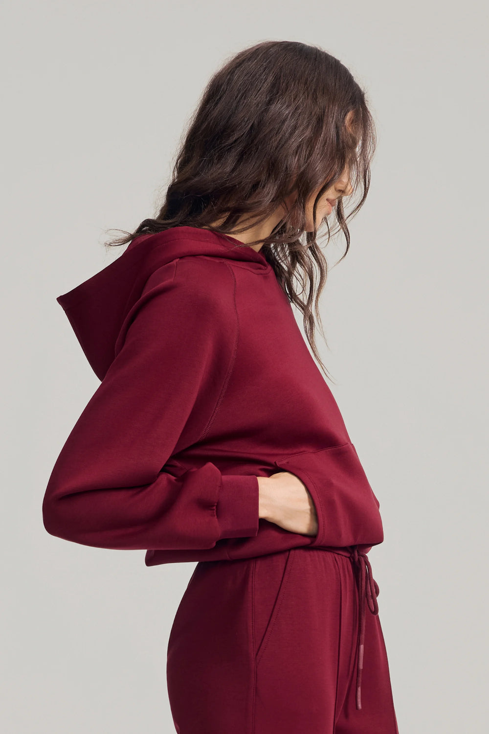 Women’s burgundy wine fleece hoodie with relaxed fit and clean neckline