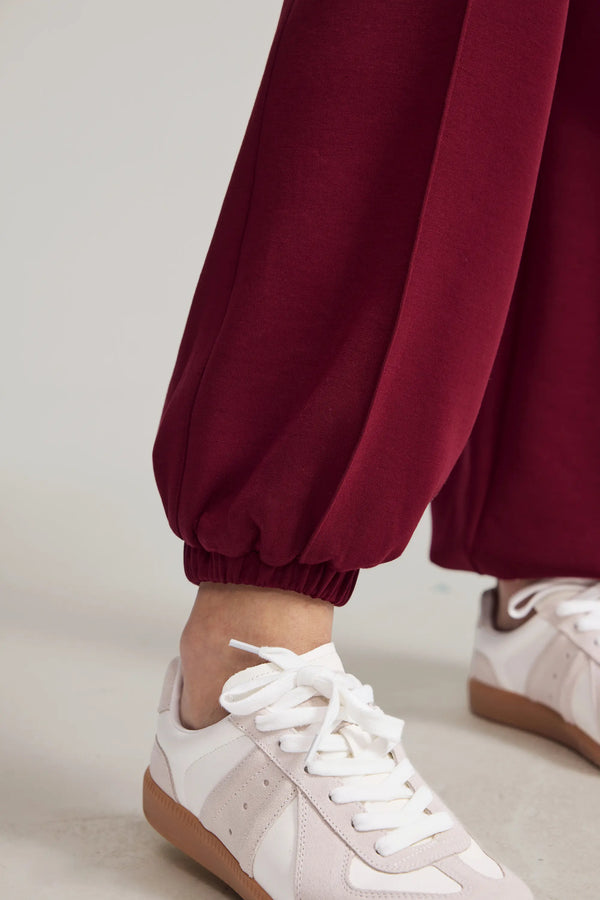 Close-up of the jogger cuff showing a gathered ankle finish and soft fleece texture