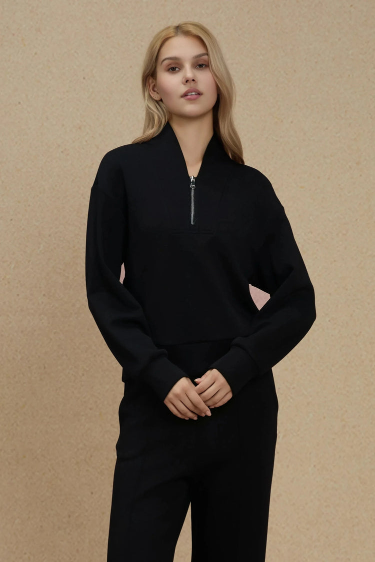 Black half-zip pullover designed for effortless, polished everyday wear