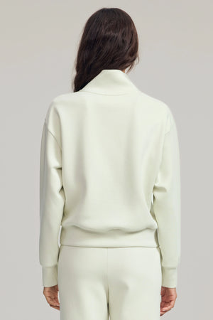 Back view of a lightweight wool-blend half-zip pullover with a clean, refined silhouette