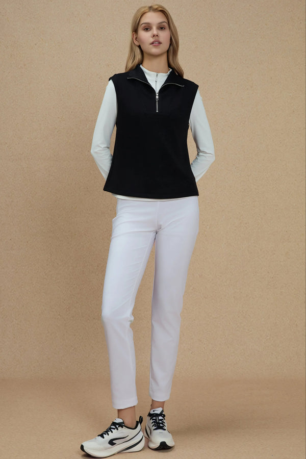 Jet Black sleeveless half-zip pullover layered over a white long-sleeve top for a modern performance look