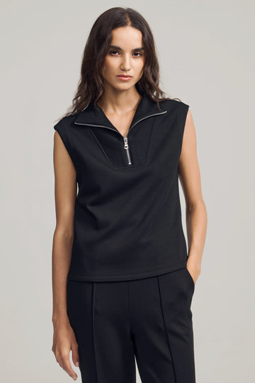 Modern zip-collar sleeveless pullover in Jet Black styled with matching sweatpants, front view on grey background