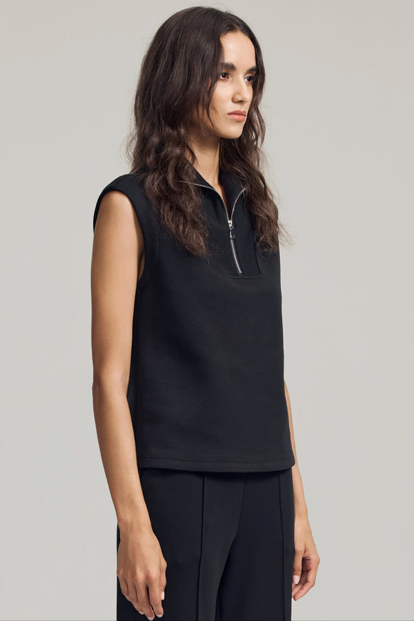 Side view of a sleeveless half-zip pullover in black featuring a clean, sculpted silhouette
