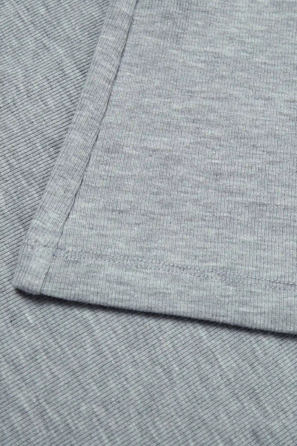 Close-up of heather grey racerback tank back detailing and refined construction