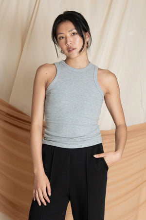 Women’s heather grey racerback tank with clean high neckline and contoured fit