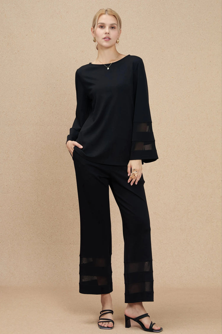 Sheer panel set in soft crepe styled for a minimal, polished look on an earth-tone background