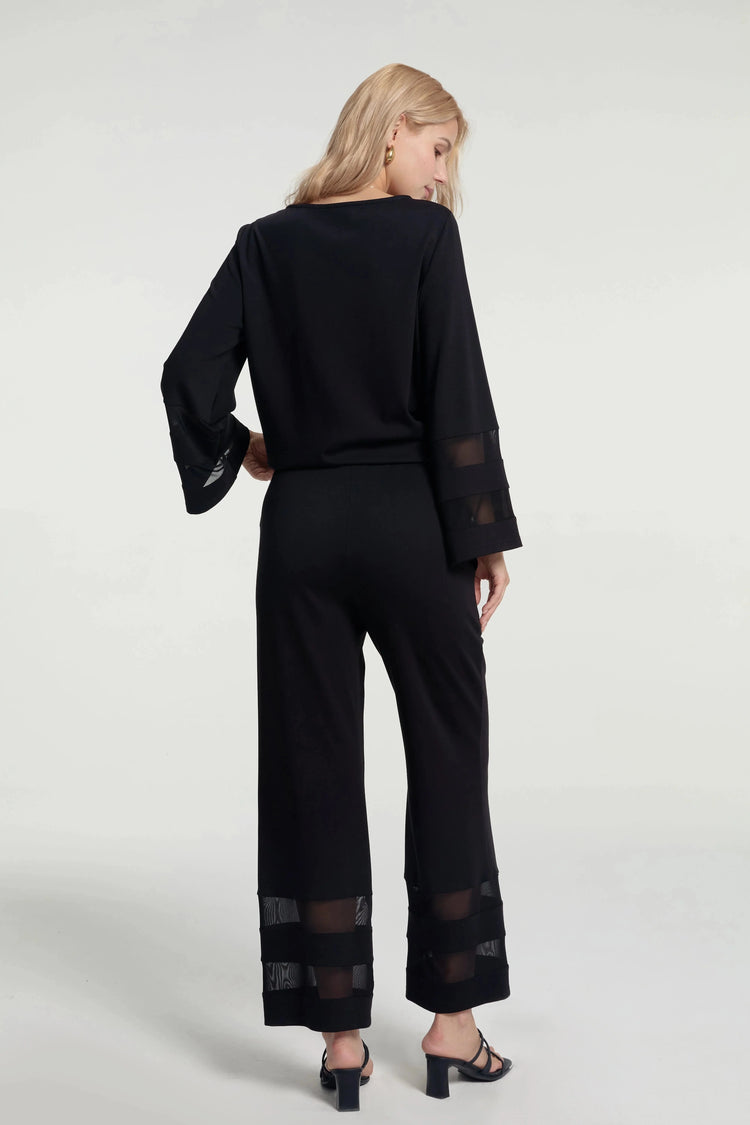 Back view of a refined sheer panel crepe set with softly tailored silhouette