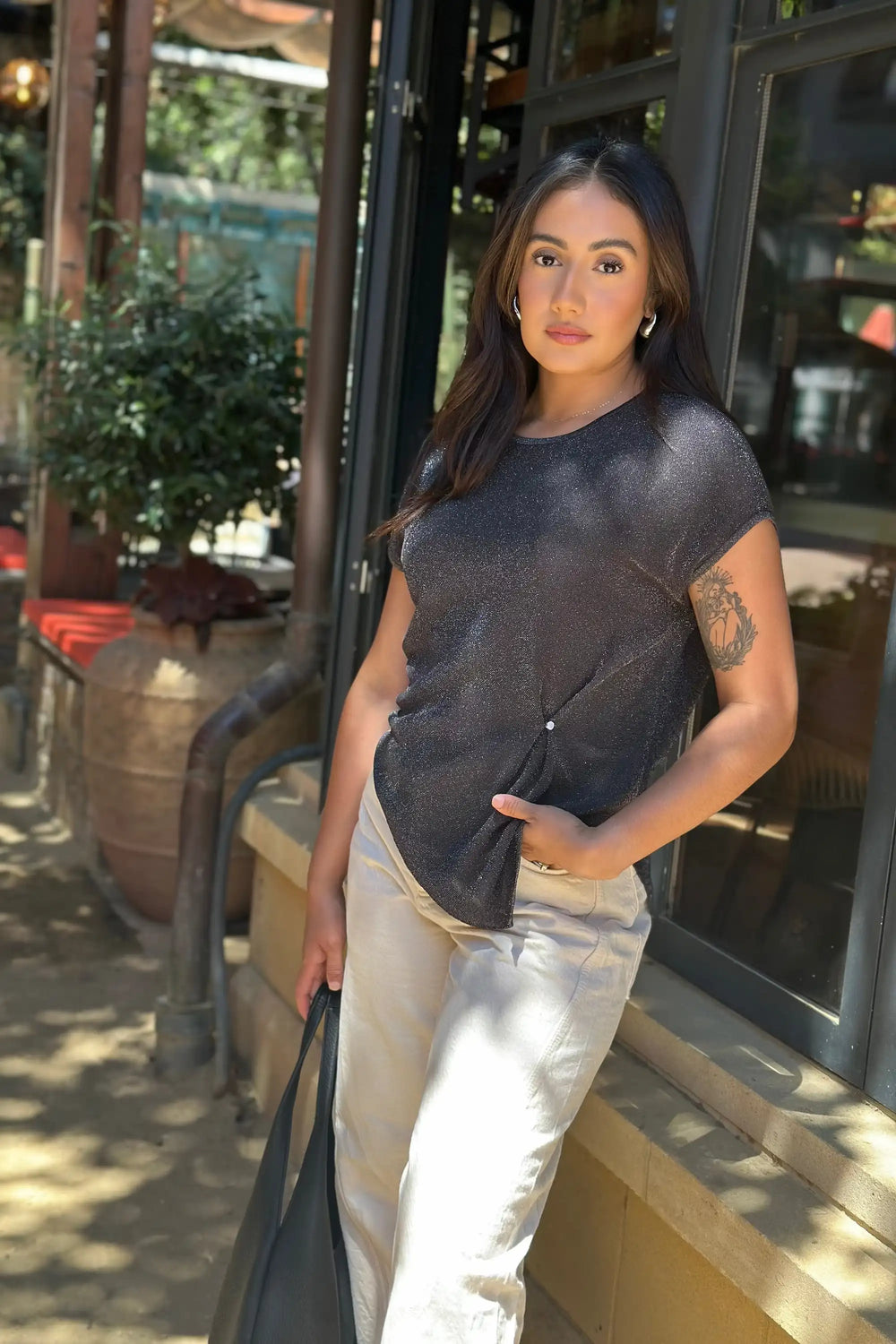 Women’s shimmer jersey cap sleeve tee styled with white jeans, upper-body front view