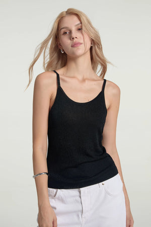 Women’s onyx glow shimmer sheer knit tank styled with white jeans, upper-body front view