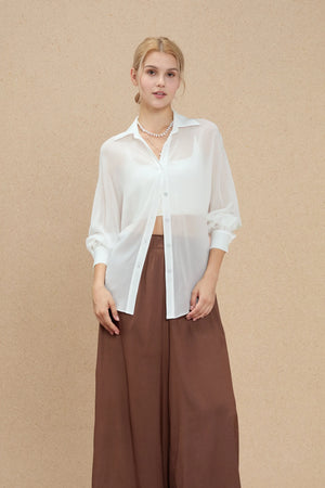 Lightweight white silk chiffon shirt with fluid movement and oversized silhouette