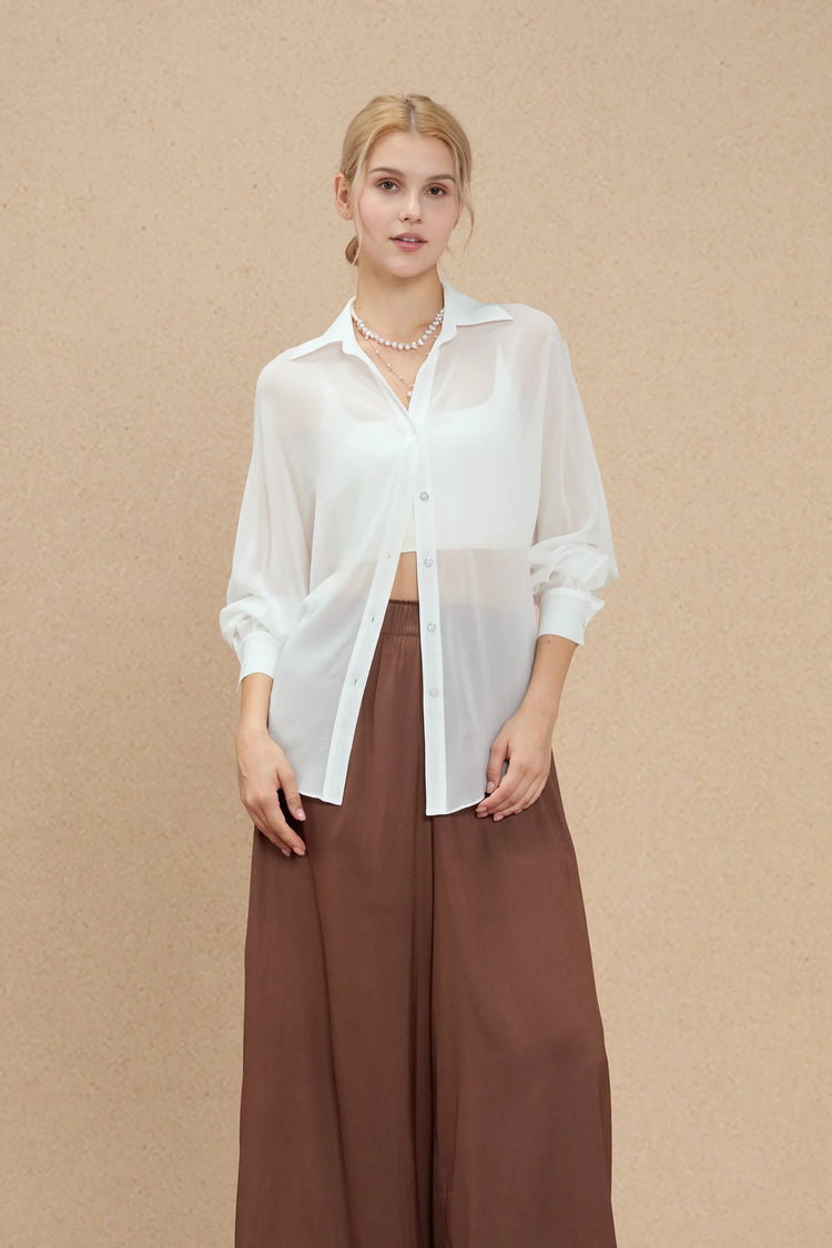 Lightweight white silk chiffon shirt with fluid movement and oversized silhouette