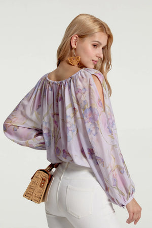 Back view of a sheer silk peasant blouse with relaxed silhouette and gentle volume